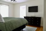 Master bedroom with TV and en suite bath
